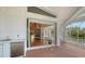 The outdoor bar area flows onto the expansive deck with easy access to the pool and indoor living spaces at 3930 Elysian Woods Ln, Sarasota, FL 34231