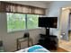 Bedroom with TV and view of bathroom at 4445 46Th W Ave, Bradenton, FL 34210