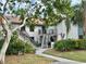 Two-story building with walkway, stairs, and landscaping at 4445 46Th W Ave, Bradenton, FL 34210