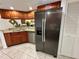 Sleek kitchen featuring stainless steel appliances and dark wood cabinetry at 4445 46Th W Ave, Bradenton, FL 34210