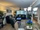 Bright living room with comfortable seating and access to patio at 4445 46Th W Ave, Bradenton, FL 34210