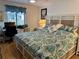 Main bedroom with king bed, workspace, and lovely bedding at 4445 46Th W Ave, Bradenton, FL 34210