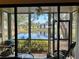 Screened porch overlooking a tranquil lake at 4445 46Th W Ave, Bradenton, FL 34210
