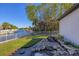 Waterfront backyard oasis with a peaceful waterfall feature at 504 Mast Dr, Bradenton, FL 34208