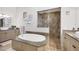 Luxurious bathroom with soaking tub, walk-in shower, and granite countertops at 504 Mast Dr, Bradenton, FL 34208