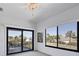Bedroom with sliding glass doors opening to a balcony and water view at 504 Mast Dr, Bradenton, FL 34208