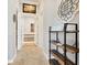 Bright hallway with open shelving and access to a bathroom at 504 Mast Dr, Bradenton, FL 34208
