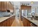 Spacious kitchen with granite countertops, stainless steel appliances, and ample cabinetry at 504 Mast Dr, Bradenton, FL 34208