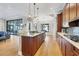 Gourmet kitchen with granite island, custom cabinetry, and stainless steel appliances at 504 Mast Dr, Bradenton, FL 34208