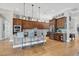 Open concept kitchen with granite island, stainless steel appliances, and hardwood floors at 504 Mast Dr, Bradenton, FL 34208