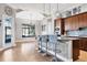 Island kitchen with breakfast bar, hardwood floors, and view to backyard at 504 Mast Dr, Bradenton, FL 34208