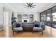 Spacious living area featuring a sectional sofa, fireplace, and access to patio at 504 Mast Dr, Bradenton, FL 34208
