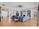 Open living space with hardwood floors, sectional sofa, and views to the kitchen at 504 Mast Dr, Bradenton, FL 34208