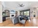 Open-concept living room with hardwood floors, built-ins, and a fireplace at 504 Mast Dr, Bradenton, FL 34208