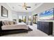 Large main bedroom with water views, walk-in closet, and plush carpeting at 504 Mast Dr, Bradenton, FL 34208