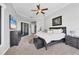 Spacious main bedroom with large windows, walk-in closet, and plush carpeting at 504 Mast Dr, Bradenton, FL 34208