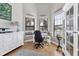 Bright office with built-in cabinetry, hardwood floors, and large windows at 504 Mast Dr, Bradenton, FL 34208
