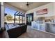 Outdoor kitchen with stainless steel appliances and seating area at 504 Mast Dr, Bradenton, FL 34208