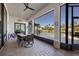 Screened patio with dining table and chairs, overlooking the pool at 504 Mast Dr, Bradenton, FL 34208