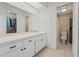 Well-lit bathroom with tiled shower, and a large mirror over the white vanity at 5111 26Th St. Ct, W # 53, Bradenton, FL 34207