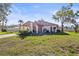 Well-maintained single-story home with a lush green lawn and mature trees in a desirable neighborhood at 5111 26Th St. Ct, W # 53, Bradenton, FL 34207
