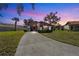 Charming home with a well-manicured lawn and a spacious driveway under a colorful evening sky at 5111 26Th St. Ct, W # 53, Bradenton, FL 34207