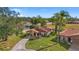 Inviting single-story home with a well-manicured lawn, beautiful landscaping, and porte-cochère at 5111 26Th St. Ct, W # 53, Bradenton, FL 34207