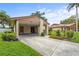 Single-story home featuring a covered carport, well-maintained lawn, and tasteful landscaping at 5111 26Th St. Ct, W # 53, Bradenton, FL 34207