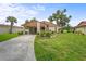 Charming single-story home with well-manicured lawn, inviting landscaping, and a convenient attached carport at 5111 26Th St. Ct, W # 53, Bradenton, FL 34207