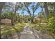 Pathway through a lush, tree-lined area near a community pool at 5111 26Th St. Ct, W # 53, Bradenton, FL 34207