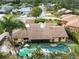 Aerial view showcasing home, pool, and surrounding landscape at 5423 Creeping Hammock Dr, Sarasota, FL 34231