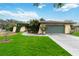 Single-story house with a green garage door and well-manicured lawn at 5423 Creeping Hammock Dr, Sarasota, FL 34231