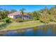 Aerial view of house near lake at 7443 Riviera Cv, Lakewood Ranch, FL 34202