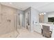 Bathroom boasts a large shower, double vanity, and a toilet in a separate room at 7443 Riviera Cv, Lakewood Ranch, FL 34202