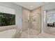 Bathroom features a spacious shower, a large soaking tub, and a window at 7443 Riviera Cv, Lakewood Ranch, FL 34202