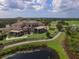 The expansive clubhouse offers stunning views of the golf course at 7443 Riviera Cv, Lakewood Ranch, FL 34202