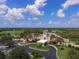 An elegant clubhouse overlooks the golf course and surrounding landscape at 7443 Riviera Cv, Lakewood Ranch, FL 34202