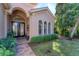Elegant entryway with a double door and decorative columns at 7443 Riviera Cv, Lakewood Ranch, FL 34202