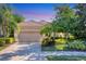 Beautiful home with a well-manicured lawn and a paved driveway at 7443 Riviera Cv, Lakewood Ranch, FL 34202