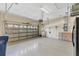 Spacious garage with overhead storage at 7443 Riviera Cv, Lakewood Ranch, FL 34202