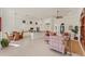 Open concept kitchen with white cabinets, granite countertops and island at 7443 Riviera Cv, Lakewood Ranch, FL 34202