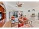 Open living room with a view into the kitchen and access to the pool area at 7443 Riviera Cv, Lakewood Ranch, FL 34202