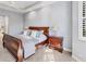 Main bedroom with a comfortable sleigh bed and soft carpeting at 7443 Riviera Cv, Lakewood Ranch, FL 34202