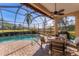 Relaxing poolside patio with seating and outdoor dining area at 7443 Riviera Cv, Lakewood Ranch, FL 34202
