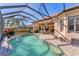 Inviting pool with screened enclosure and patio furniture at 7443 Riviera Cv, Lakewood Ranch, FL 34202