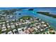 Wide aerial showcasing a home's location on the waterfront at 747 Marbury Ln, Longboat Key, FL 34228