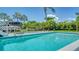 Relaxing pool and patio with lush landscaping at 747 Marbury Ln, Longboat Key, FL 34228