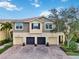 Attractive townhome with attached garages and brick paver driveway at 7786 Moonstone Dr # 7-204, Sarasota, FL 34233