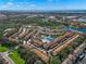 Aerial view of community with pool, tennis court, and water access at 8369 Wingate Dr # 2114, Sarasota, FL 34238