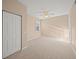 Bright bedroom with carpet flooring and a double door closet at 8369 Wingate Dr # 2114, Sarasota, FL 34238